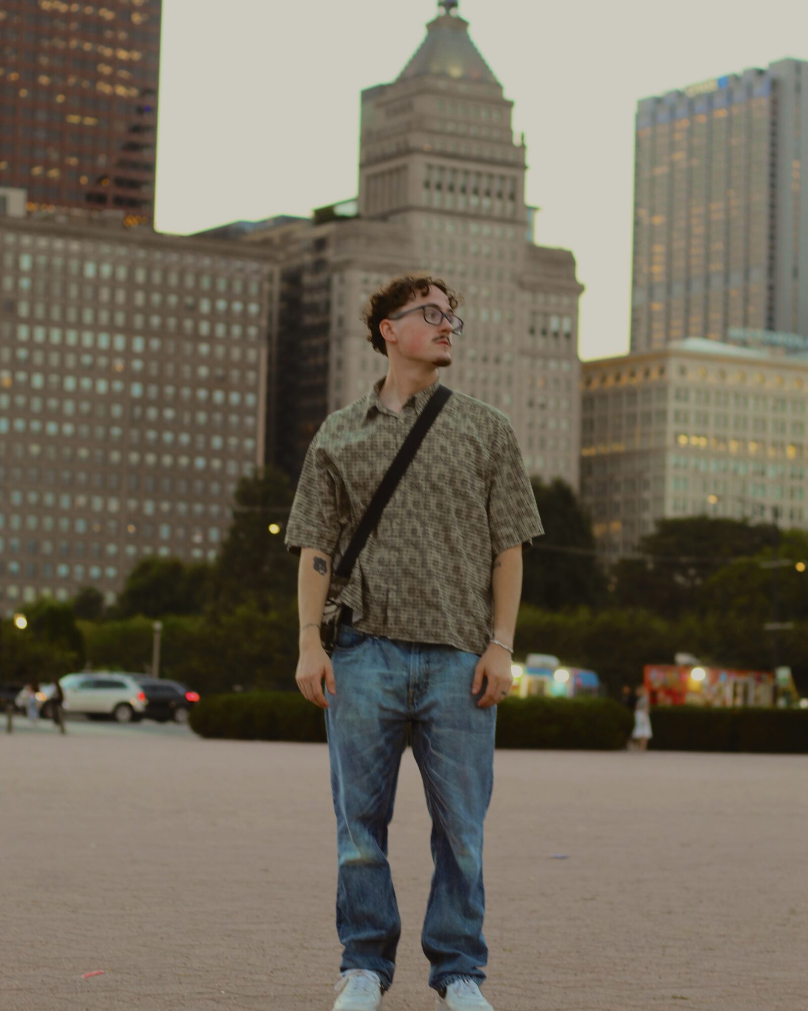 Portrait of a man standing in downtown Chicago at golden hour